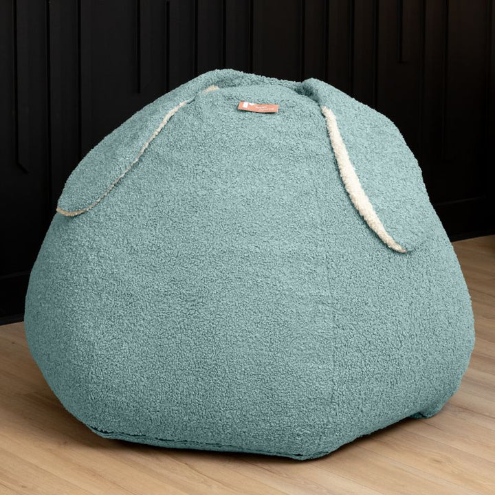 Raven-Symoné HopSeat sherpa bean bag chair in green, a low-angle view showing the bunny-ear detail and deep-pressure comfort