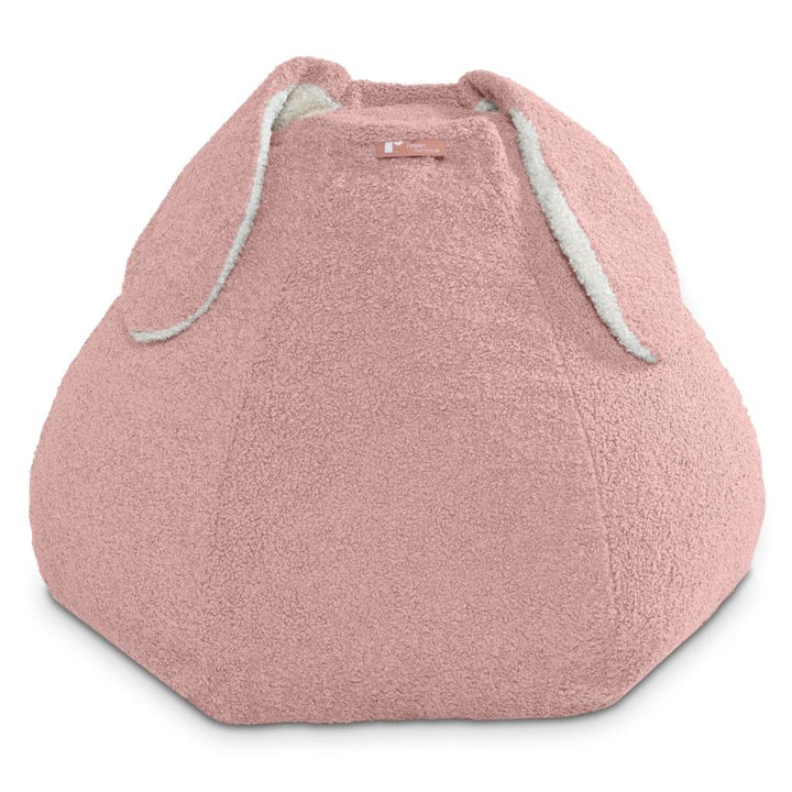 Raven-Symoné HopSeat sherpa bean bag chair in pink, a soft sensory bean bag chair with bunny-ear design