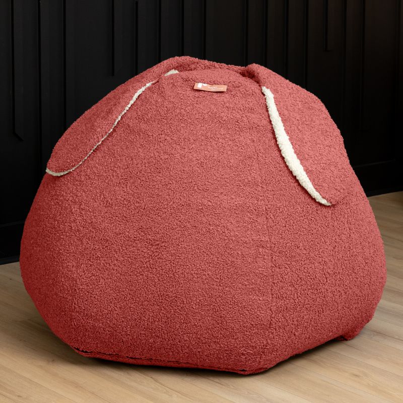 Raven-Symoné HopSeat sherpa bean bag chair in Rosewood Red, a low-angle view showing the bunny-ear detail and deep-pressure comfort