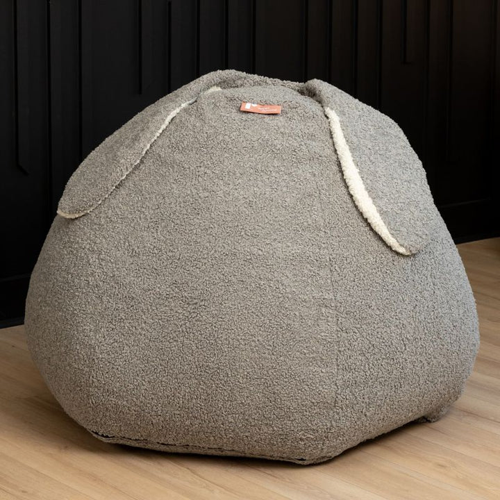 Raven-Symoné HopSeat sherpa bean bag chair in Smoke, a low-angle view showing the bunny-ear detail and deep-pressure comfort
