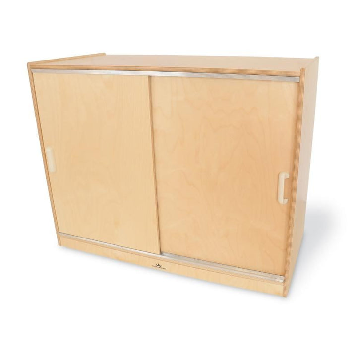 Whitney Brothers Sliding Doors Storage Cabinet front view with doors closed, a birch plywood cabinet that keeps classroom and playroom supplies out of sight