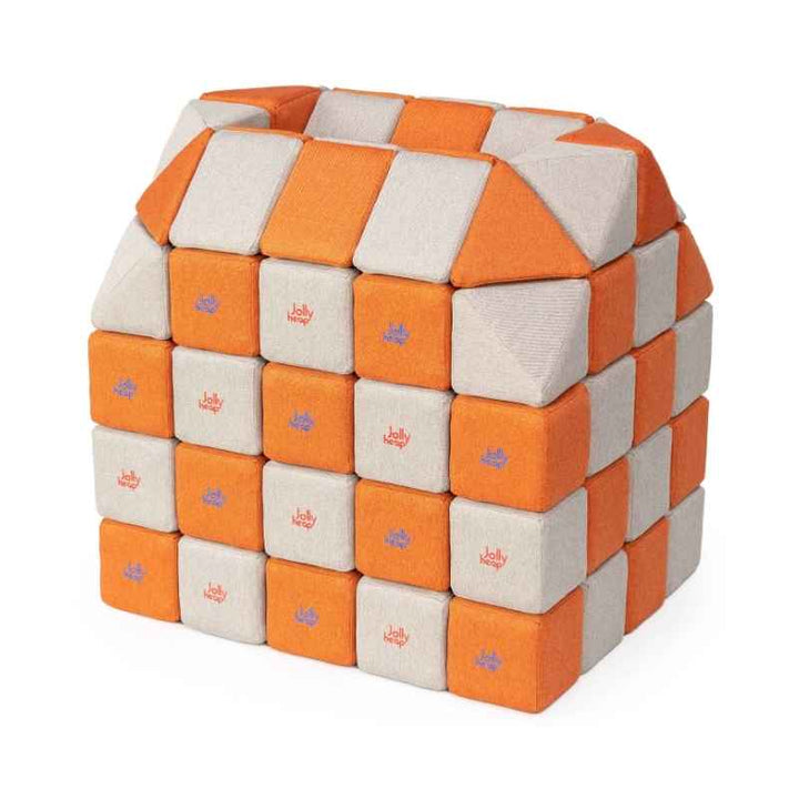 A small structure built with JollyHeap Creative Set soft magnetic blocks in an orange and grey colour combination