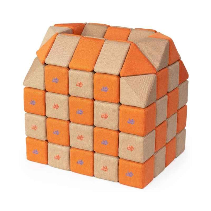 A small structure built with JollyHeap Creative Set soft magnetic blocks in an orange and light brown colour combination
