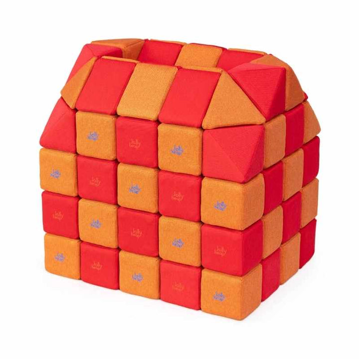 A small structure built with JollyHeap Creative Set soft magnetic blocks in a red and orange colour combination