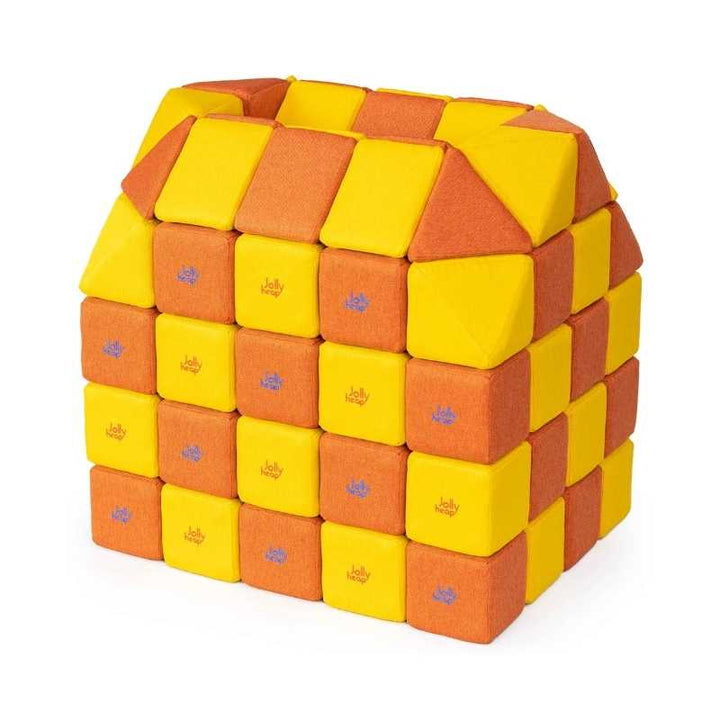 A small structure built with JollyHeap Creative Set soft magnetic blocks in a yellow and orange colour combination