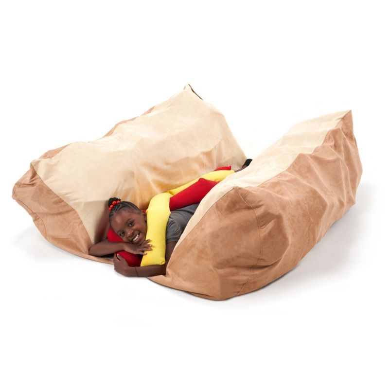 Southpaw Hot Dog Floor Mat with a child lying inside the foam bun, demonstrating postural positioning and proprioceptive sensory input during therapy