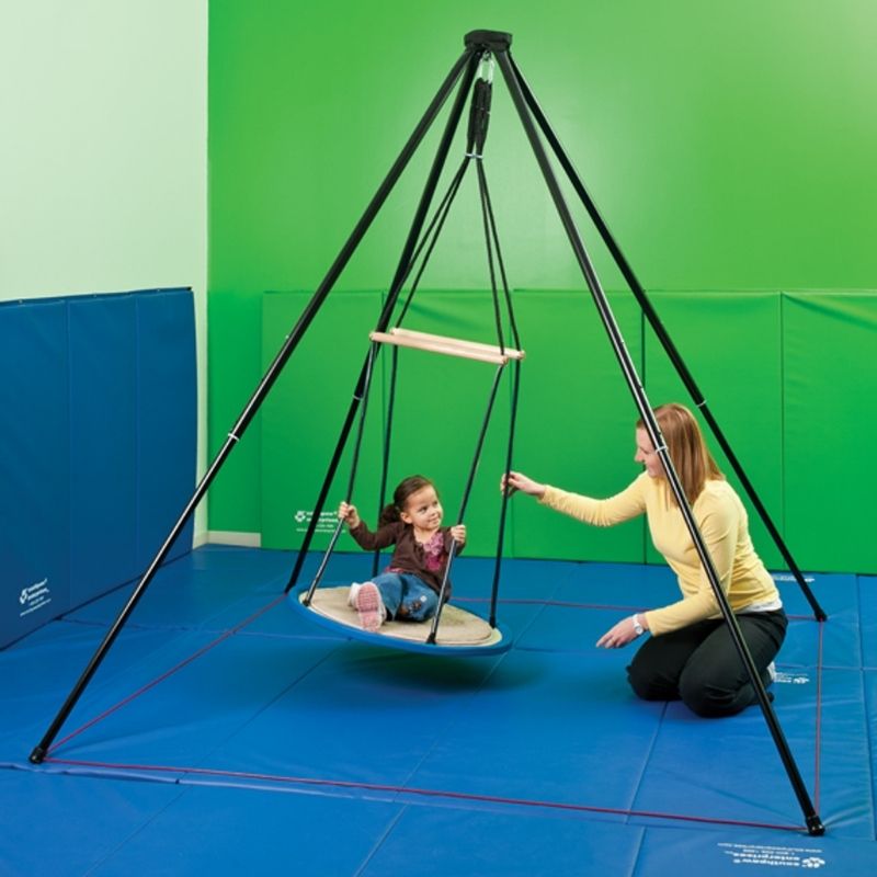 Southpaw Itinerant Support Frame in use with a child and caregiver, showing freestanding portable therapy swing setup for vestibular sensory therapy