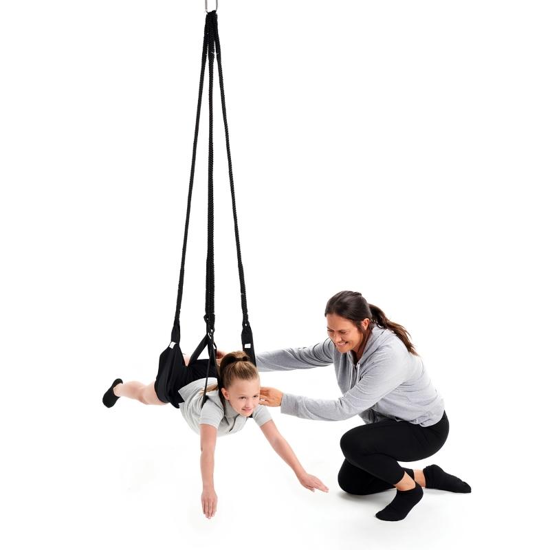 Mother and child using the Southpaw Standard Dual Swing together, demonstrating dual-client vestibular therapy swing use for sensory integration