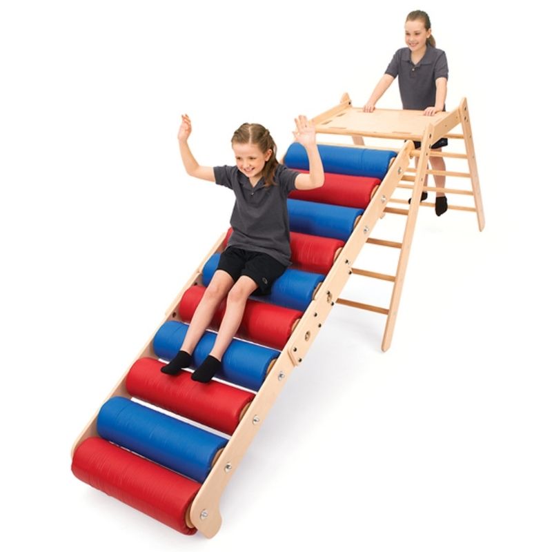 Southpaw Steamroller Ramp and Platform Set with two children actively crawling through the deep pressure rollers for sensory motor play