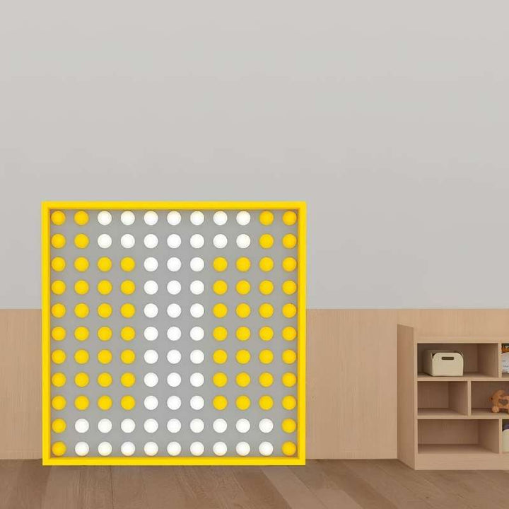 LiteZilla Spinfinity Wall interactive spinning wall panel shown in a classroom setting with a yellow frame and colour pattern design 