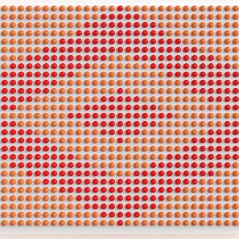 LiteZilla Spinfinity Wall interactive spinning wall panel displaying a custom heart pattern in orange and red on a wide panel