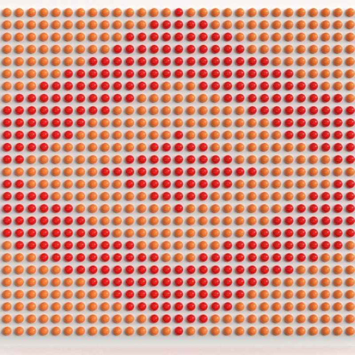 LiteZilla Spinfinity Wall interactive spinning wall panel displaying a custom heart pattern in orange and red on a wide panel
