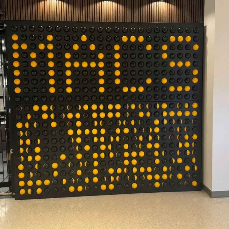 LiteZilla Spinfinity Wall interactive spinning wall panel installed in a mall showing a custom pattern created across the sphere shapes