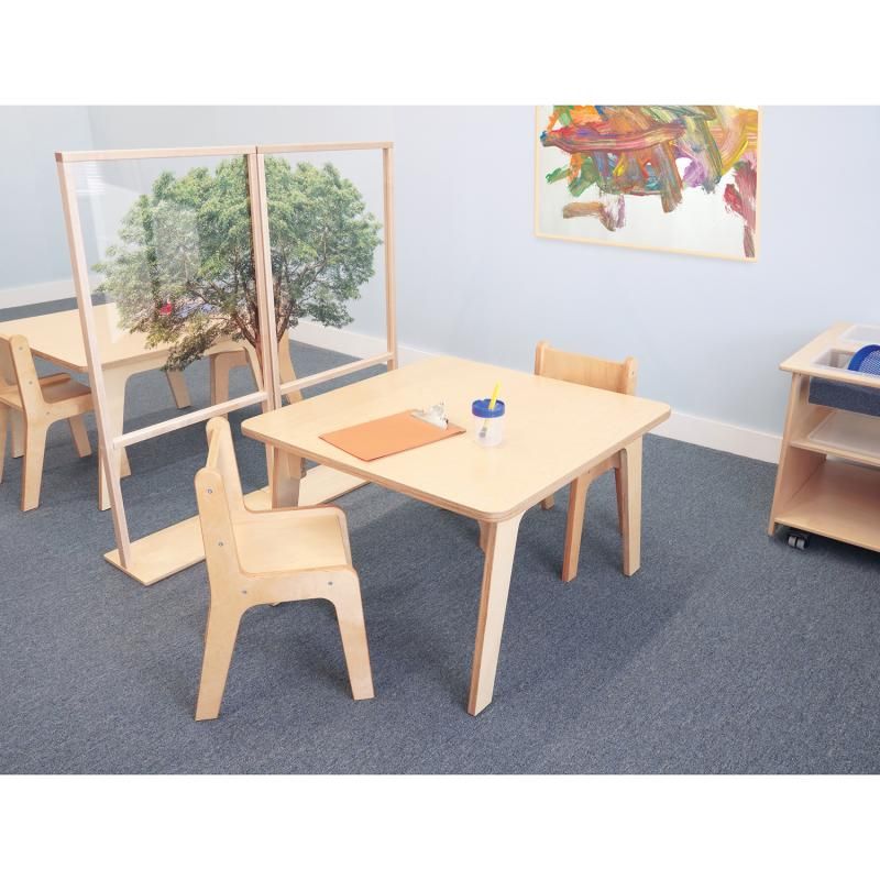 Whitney Brothers Whitney Plus Square Activity Table 22H in a bright classroom with natural wood chairs and a clipboard for quiet table work