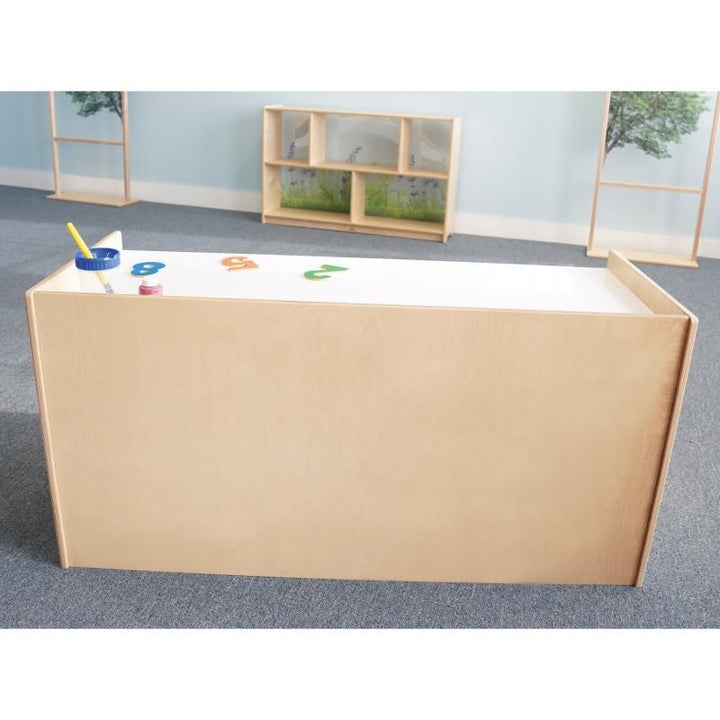 Back view of the Whitney Brothers STEM Activity Desk with Trays in a classroom, showing the finished birch plywood panel of this two-student preschool STEM desk