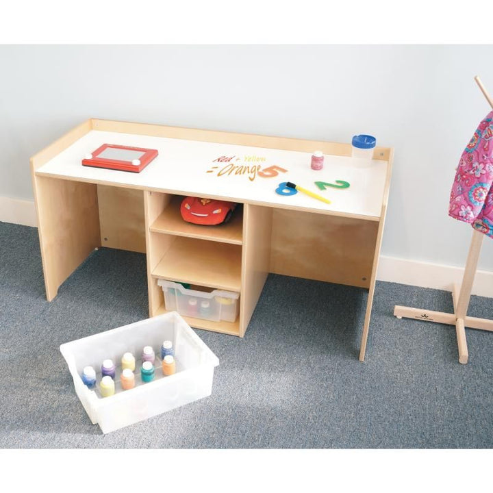 Whitney Brothers STEM Activity Desk with Trays with color mixing written on the dry erase activity table surface and a Gratnell tray of paint bottles pulled out beside the desk