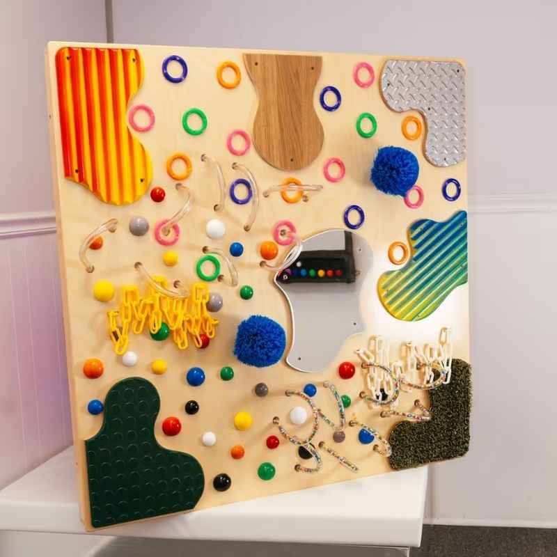 TFH Textured Wall Panel shown at an angle, a tactile wall panel with fifteen textures including corrugated, mirror and looped surfaces for sensory exploration