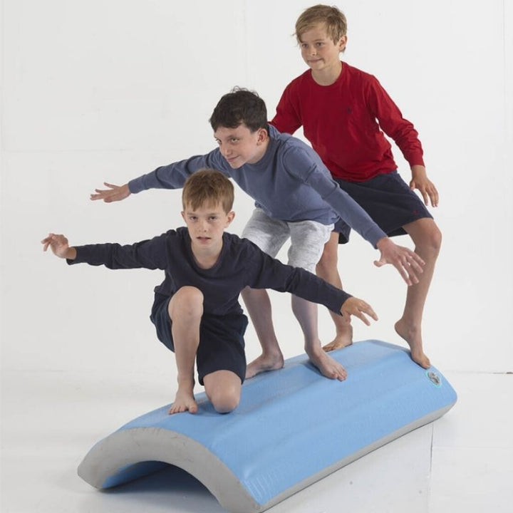Two boys using the TFH Soft Inflatable Body Rocker for balance and motor planning activities