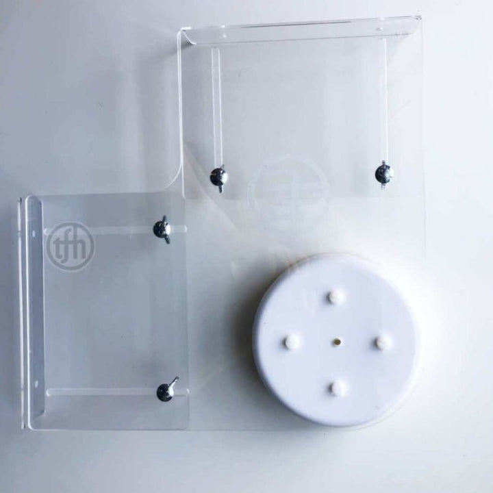 Close-up detail of the TFH telescopic bubble tube wall bracket for 6" Standard tubes, showing the adjustable arm and secure mounting construction