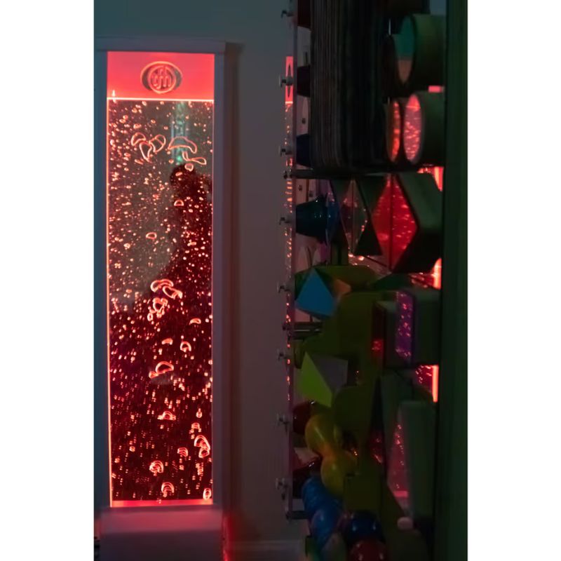 TFH Bubble Wall glowing red on a sensory room wall, a wall mounted bubble wall for calming visual play