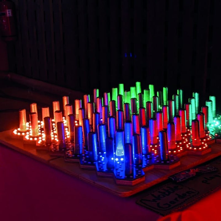 Side view of the TFH Electro Wobble Garden Activity Panel showing the 14cm depth, spring-sensor protrusion, and wall-mount profile for sensory room installation