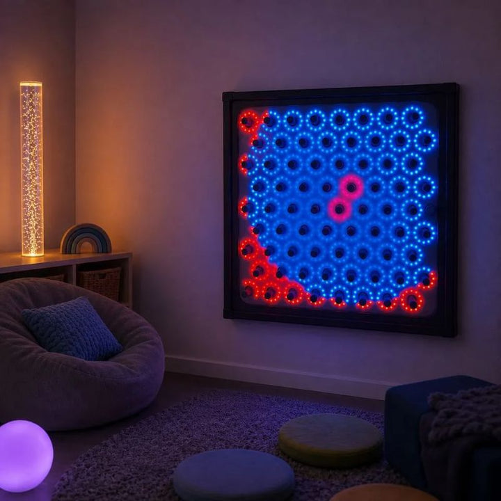 TFH Electro Wobble Garden Activity Panel mounted on a calm sensory room wall, its spring-sensors glowing blue and red beside a bubble tube and soft seating