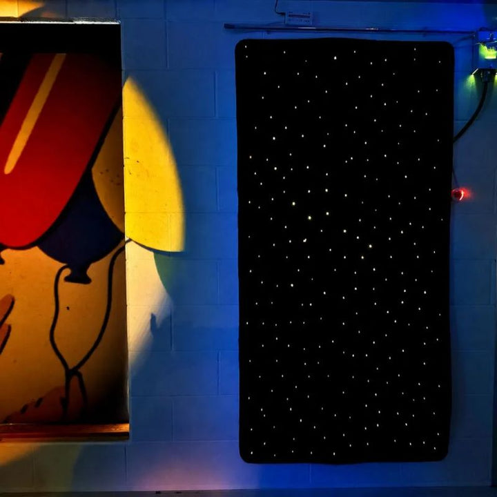 TFH Fibre Optic Carpet rectangle version mounted on a sensory room wall, its PMMA fibre optic points sparkling like a night sky to create a calming star-field wall feature