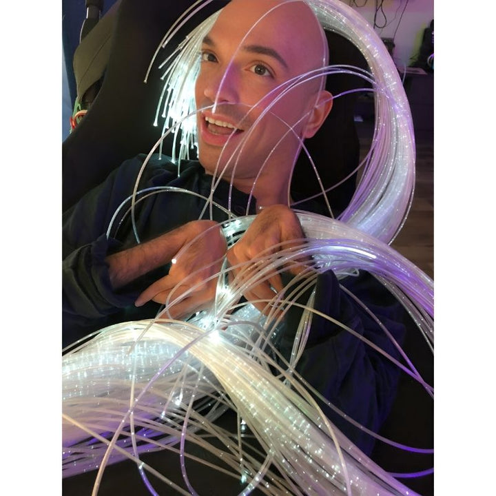 Happy adult using TFH Standard Fibre Optic Tails during a therapy session, highlighting the calming sensory light experience