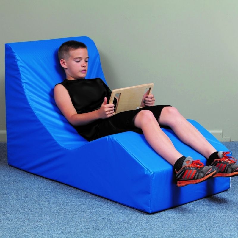 TFH Giant Foam Relax & Recline Junior size with child seated in active play position, ergonomic foam sensory lounger for proprioceptive positioning and spinal pressure relief