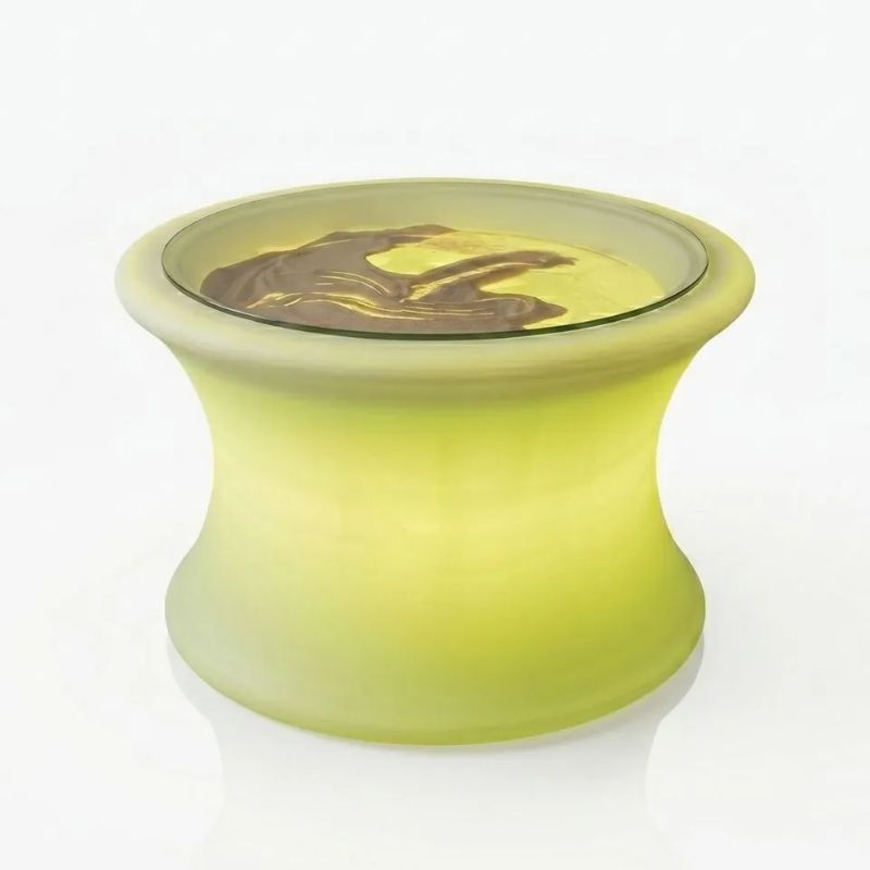 TFH Illuminated Sensory Messy Mood Table glowing yellow-green with sand beneath its glass top, a light-up sensory table for calming tactile and messy play
