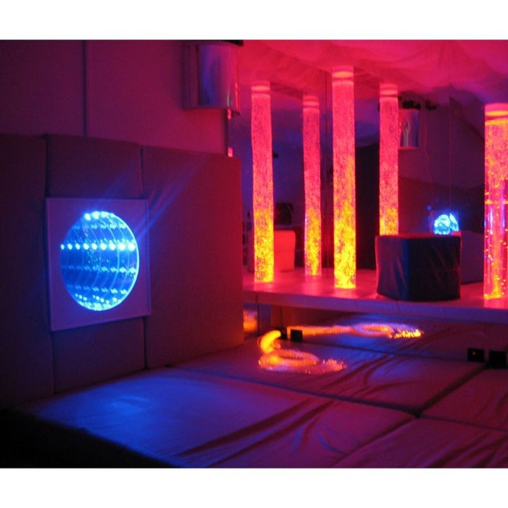 TFH Interactive Infinity Tunnel and Microphone in a sensory room landscape view with a bubble tube in the background, showing the panel as part of a multi-sensory room environment