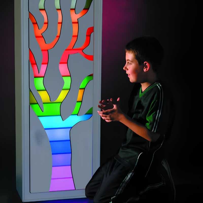 TFH Ladder Light Masks tree branch facade glowing in rainbow colours as a child interacts with the sensory Ladder Lights display