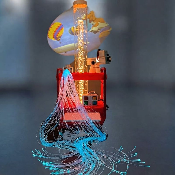 TFH Little Red Sensory Cart Deluxe Hurricane Waterless with its amber-lit snow bead tube, blue fibre optic tails and 4-button controller, the Solar 80 projector casting a hot air balloon scene
