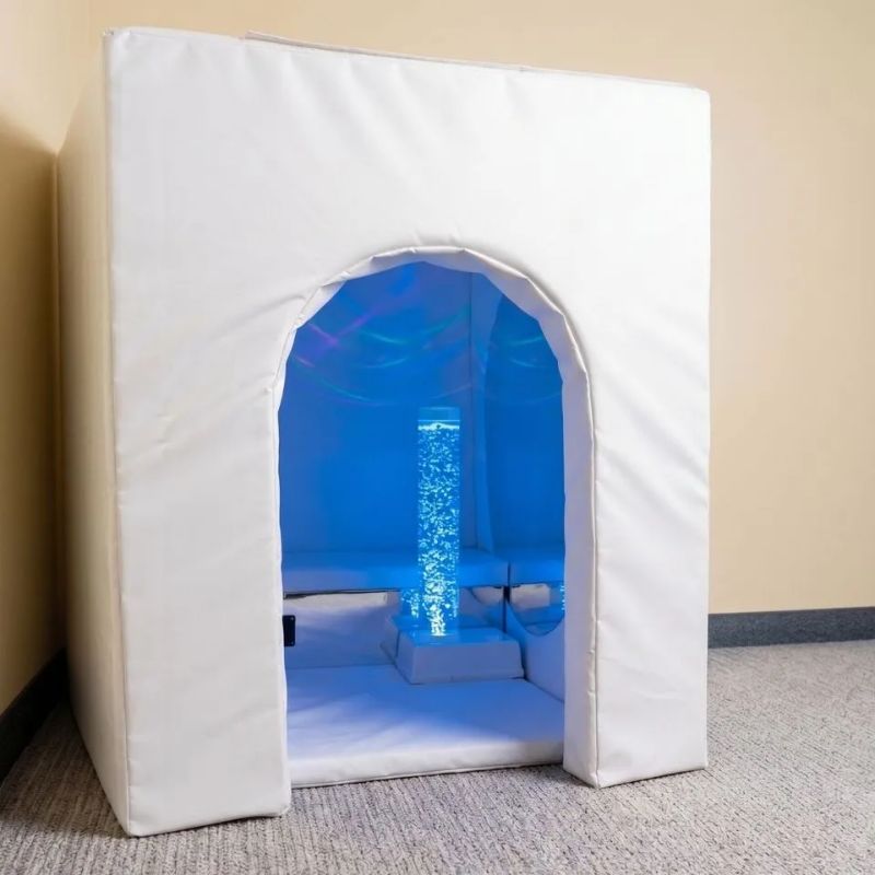 TFH Deluxe Portable Sensory Den seen from outside, with the included bubble tube glowing blue through the large arched doorway of this fold-flat calm corner