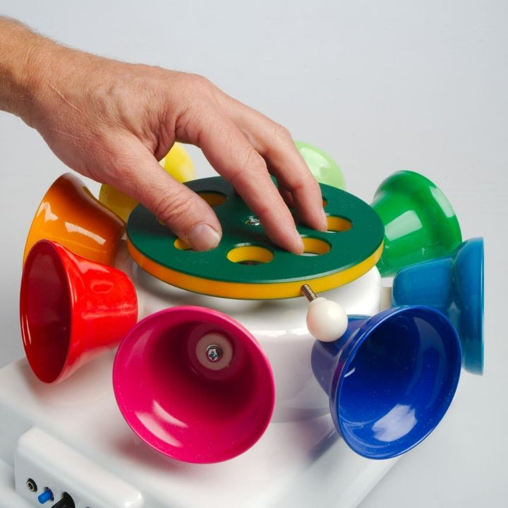 TFH Rainbow Carousel Bells rotating in motion, producing an 8-note musical scale and visual stimulation through vibrant coloured bell movement