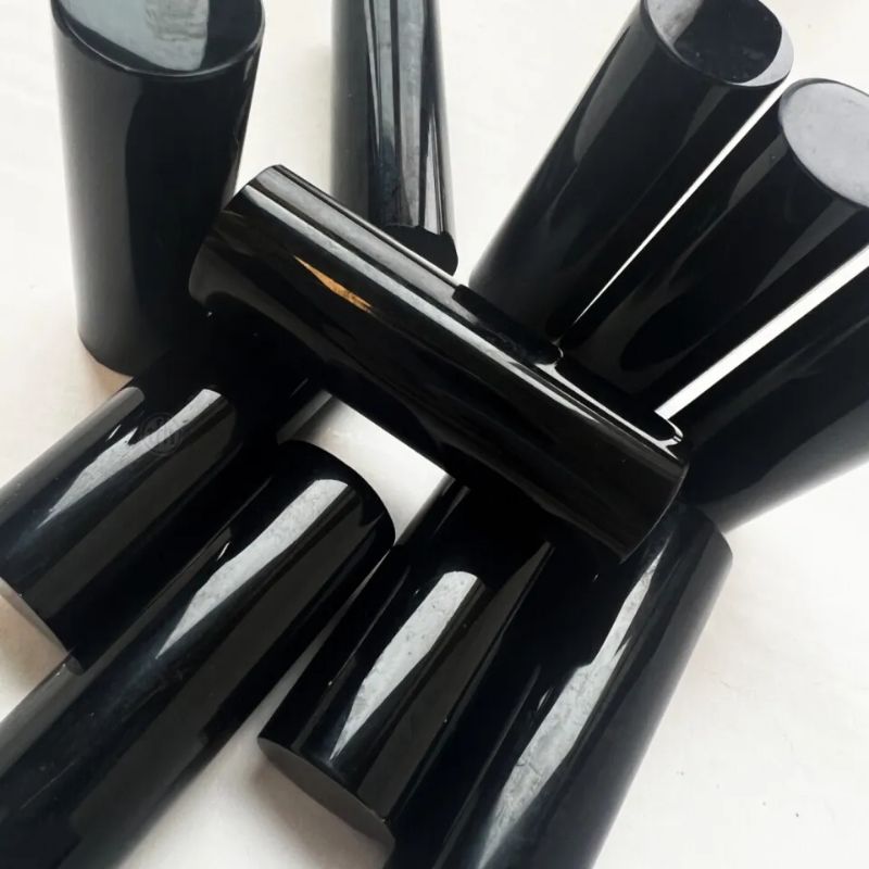 Close-up of the glossy black rods included with the TFH Rod Wall Activity Panel, the 2.25" acrylic rods used for contrast patterns and fine motor peg activities