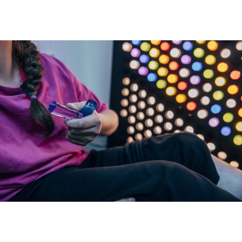TFH Rod Wall Activity Panel landscape view showing the full 22-inch wide illuminated panel with 144 colour-coded rods in a sensory room or therapy space across North America