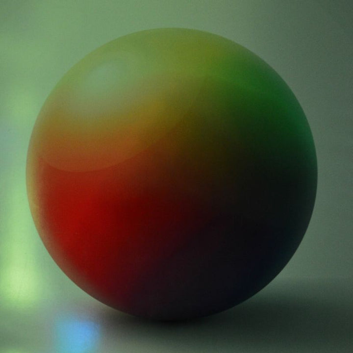 TFH Decorative Sensory Room Wall Padding Sphere design in green sensory room light, showing the 3D-effect light-responsive colour-shifting sphere wall pad reacting to room colour