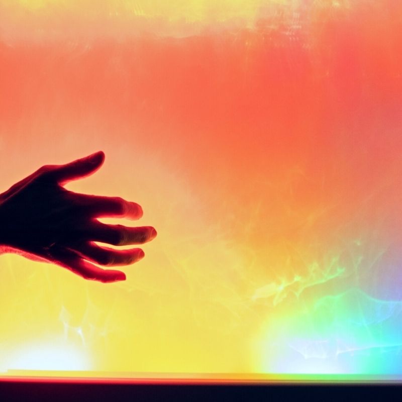A hand interacting with the TFH Sound to Light Interactive Panel, demonstrating touch-free sound-activated LED response for cause-and-effect sensory play