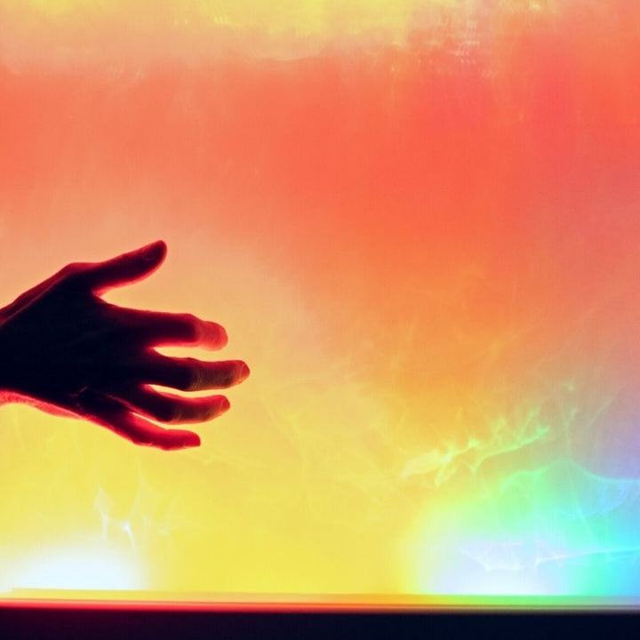 A hand interacting with the TFH Sound to Light Interactive Panel, demonstrating touch-free sound-activated LED response for cause-and-effect sensory play