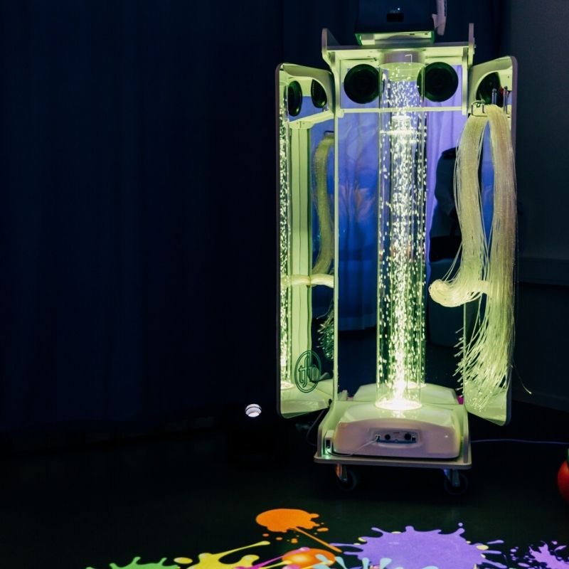 TFH Vecta Budii with 100-tail fibre optic spray glowing in warm yellow tones, providing tactile and visual sensory stimulation for therapeutic use