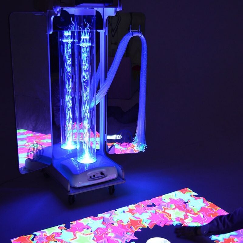 TFH Vecta Budii mobile multi-sensory cart illuminated in blue, showing the interactive bubble tube and mirrored panel array in a calming sensory environment