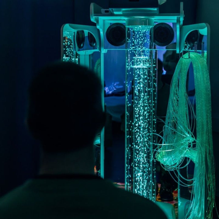 Adult engaging with the TFH Vecta Budii mobile sensory station, highlighting its suitability for multi-sensory therapy across all ages and abilities