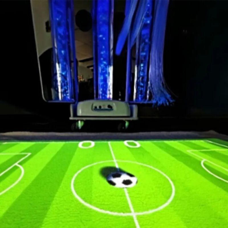 TFH Vecta Budii projecting an interactive soccer game onto the floor from the Omi Budii Ball Game Suite, turning any room into an active play space