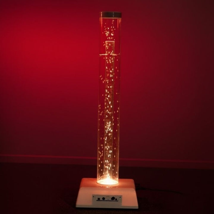 TFH Interactive Waterless Hurricane Tube 80-inch variant glowing in red light in a sensory room, showing the tallest waterless bubble column option for full-height sensory room installations