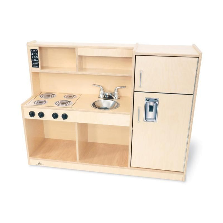 Front view of the empty Whitney Brothers Let's Play Toddler Kitchen Combo, a compact dramatic play kitchen with stove, sink, hutch and refrigerator in natural birch
