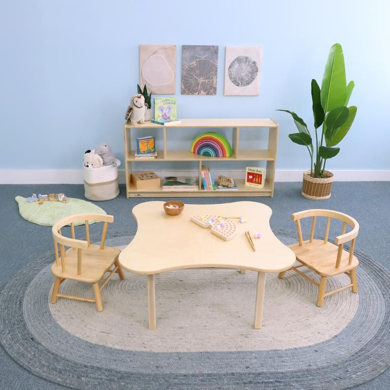 Whitney Brothers Toddler Flower Table and Chair Set in natural wood with two toddler chairs, a toddler table and chair set with a curved flower-shaped top