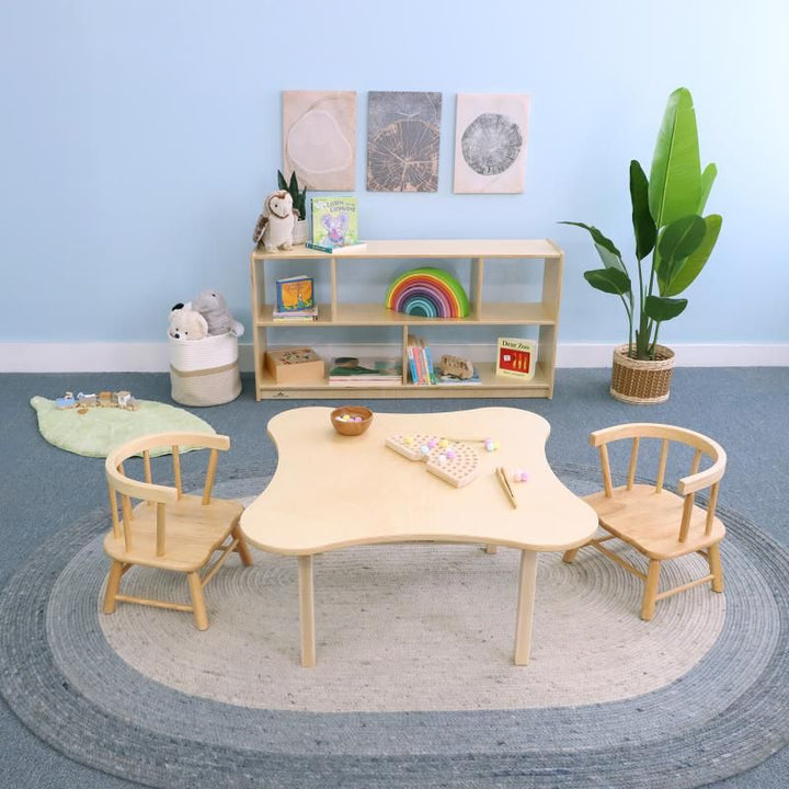 Whitney Brothers Toddler Flower Table and Chair Set in natural wood with two toddler chairs, a toddler table and chair set with a curved flower-shaped top