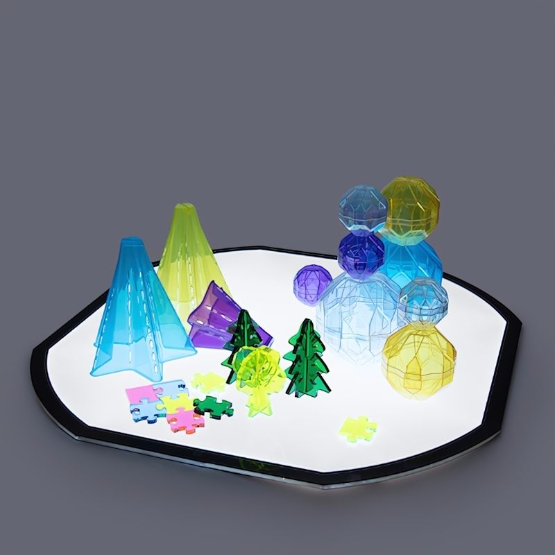 TTS Active World Tray Light Panel illuminated and glowing, a sensory light panel for early years learning and investigative play