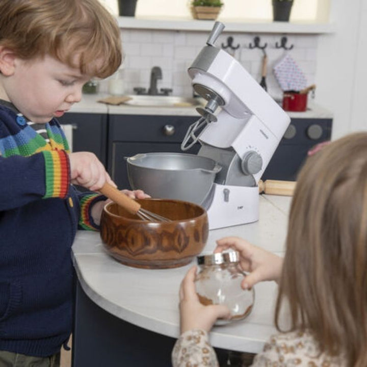 Two children engaged in dramatic play at the TTS Modern Living Breakfast Bar Island, a durable role play kitchen furniture piece for classrooms